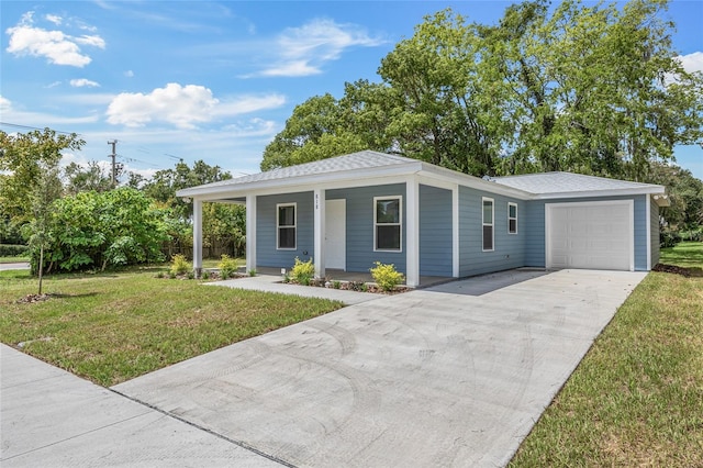 ranch-style house featuring a porch, a garage, and a front lawn