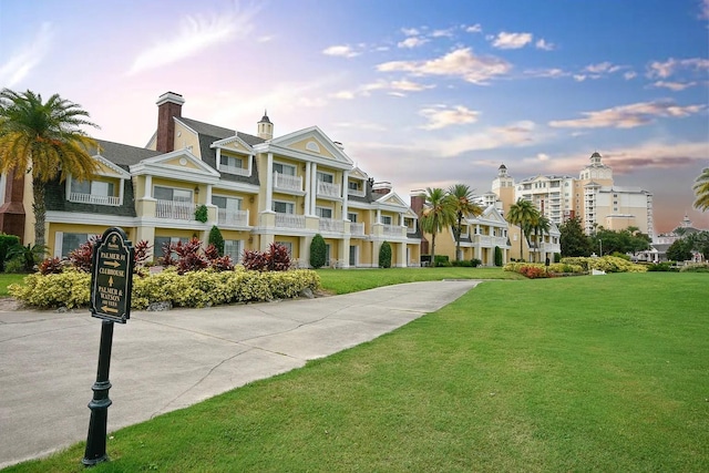 view of home's community featuring a lawn