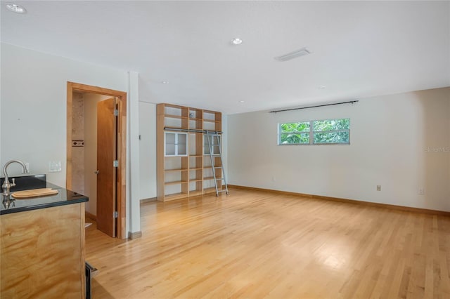 spare room featuring light wood-type flooring