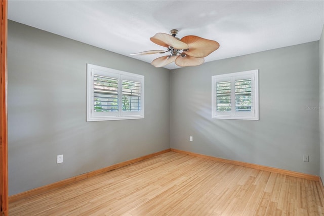 empty room with light wood-type flooring and ceiling fan