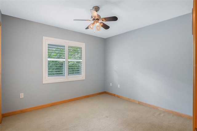 carpeted empty room with ceiling fan