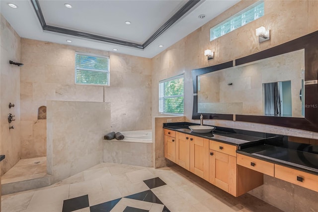 bathroom featuring plus walk in shower, a tray ceiling, vanity, and crown molding