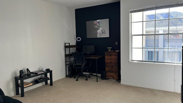 home office featuring a wealth of natural light and carpet