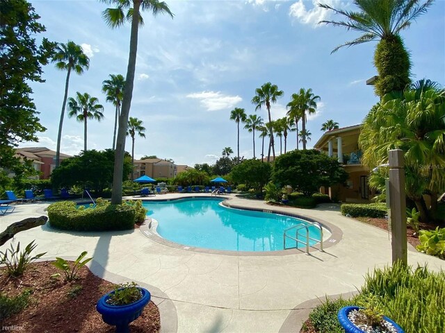 community pool with a patio