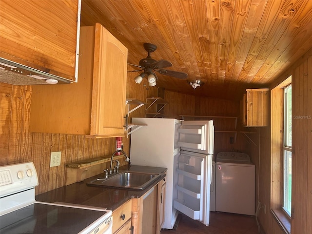 kitchen with wood ceiling, sink, white stove, washer / clothes dryer, and wood walls