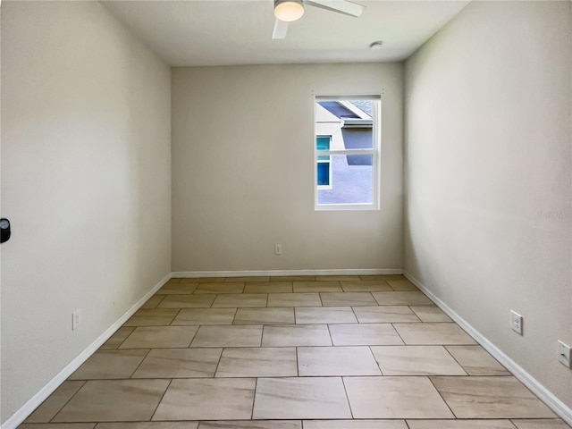 empty room featuring ceiling fan and light tile patterned floors