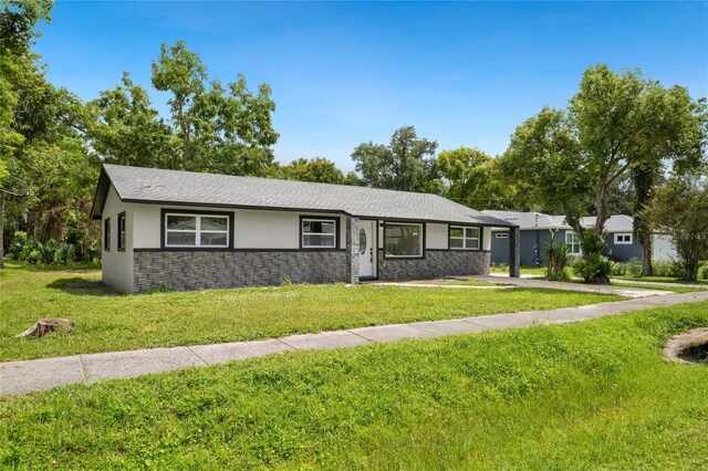 ranch-style house with a front lawn