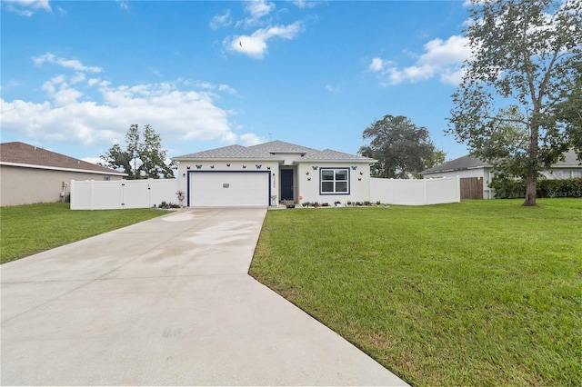 view of front of home with a front yard and a garage