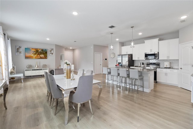 dining area featuring light hardwood / wood-style floors