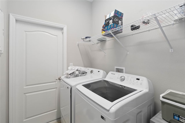 washroom with separate washer and dryer