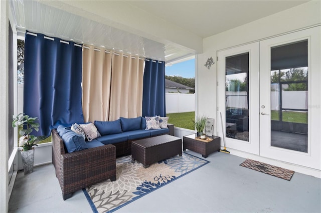 exterior space with french doors, a wealth of natural light, and concrete floors