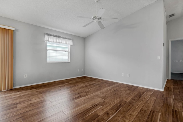 spare room with a textured ceiling, hardwood / wood-style flooring, and ceiling fan