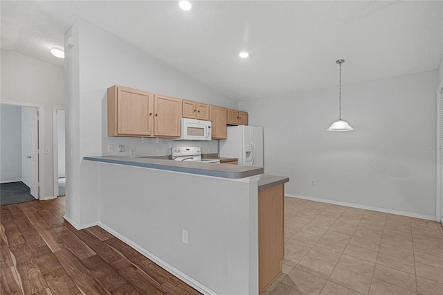 kitchen featuring white appliances, pendant lighting, kitchen peninsula, and light brown cabinetry