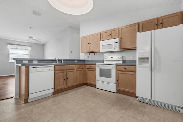 kitchen with a textured ceiling, ceiling fan, white appliances, and kitchen peninsula