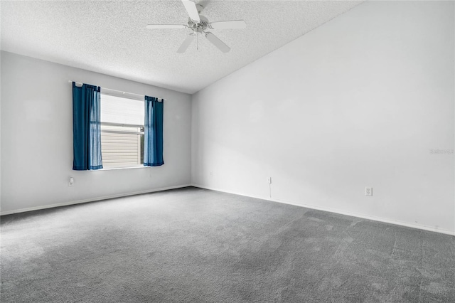 carpeted spare room with a textured ceiling and ceiling fan