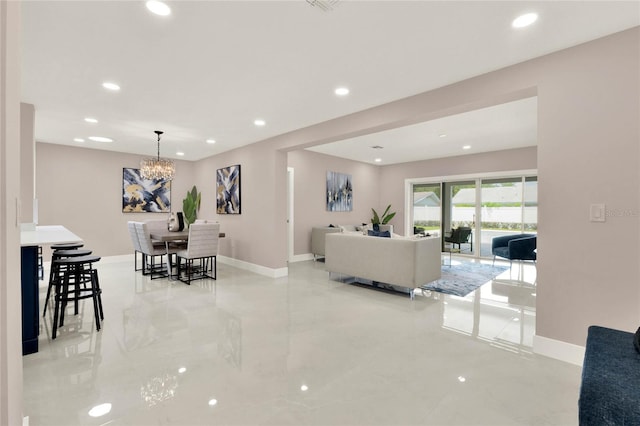 living room with an inviting chandelier