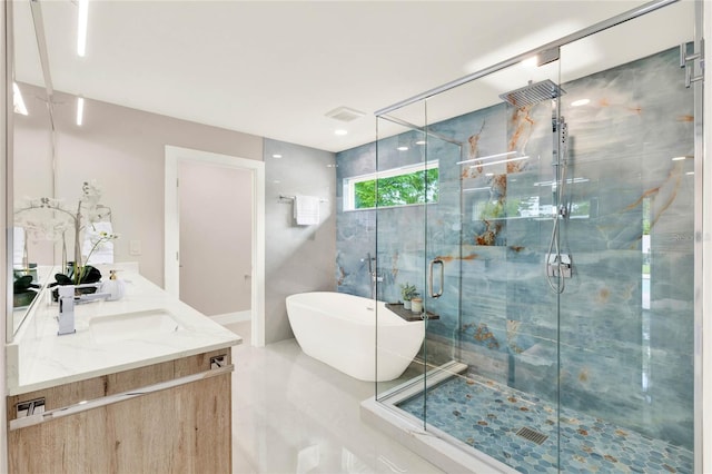 bathroom featuring tile patterned flooring, vanity, and separate shower and tub