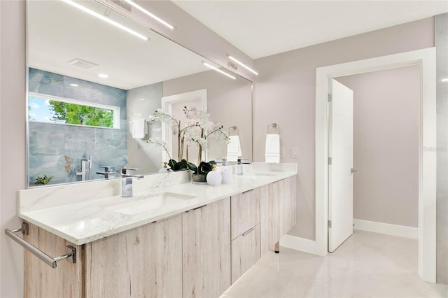 bathroom featuring concrete floors and vanity