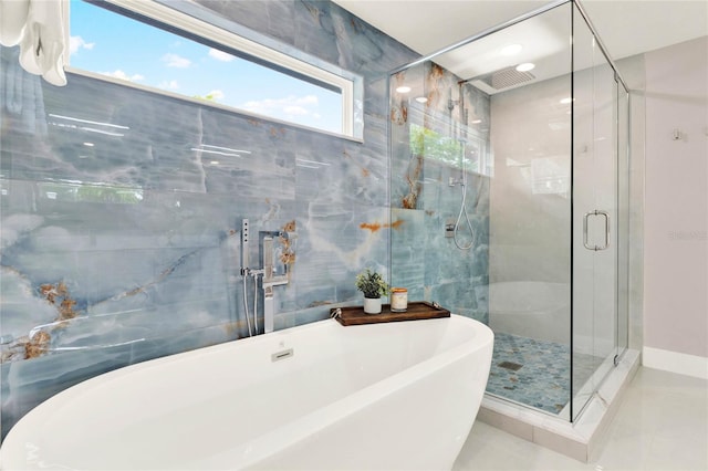 bathroom with tile patterned floors and plus walk in shower