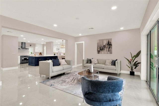 living room featuring a notable chandelier