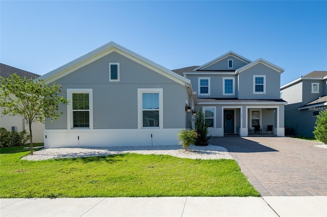 view of front of home with covered porch and a front yard