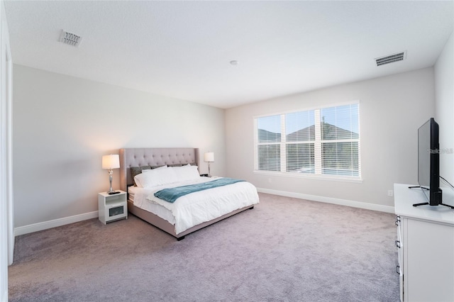 bedroom featuring light colored carpet