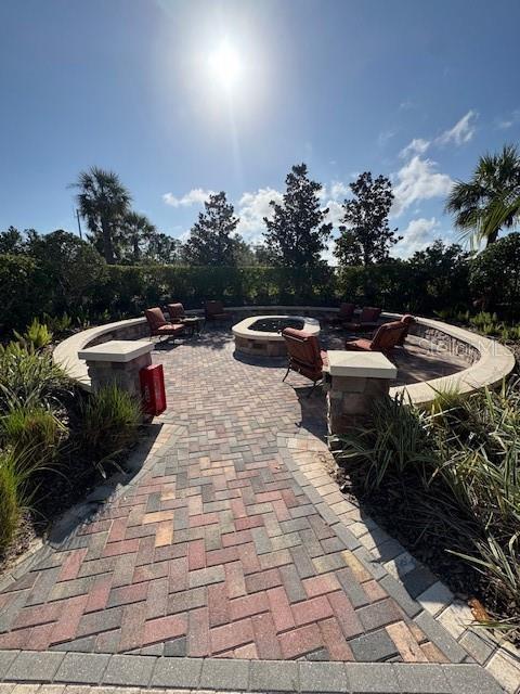 view of patio / terrace with an outdoor fire pit