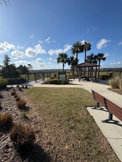 surrounding community featuring a gazebo and a yard