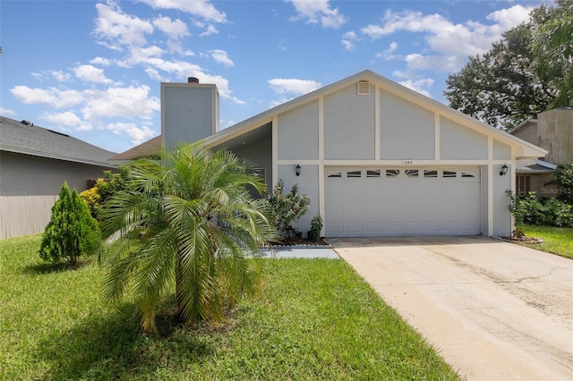 view of front of property with a garage and a front yard