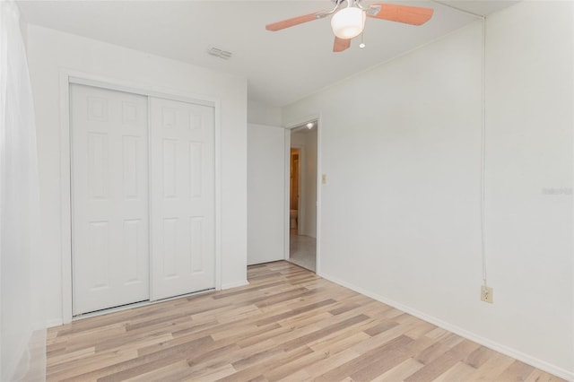 unfurnished bedroom featuring a closet, ceiling fan, and light hardwood / wood-style floors