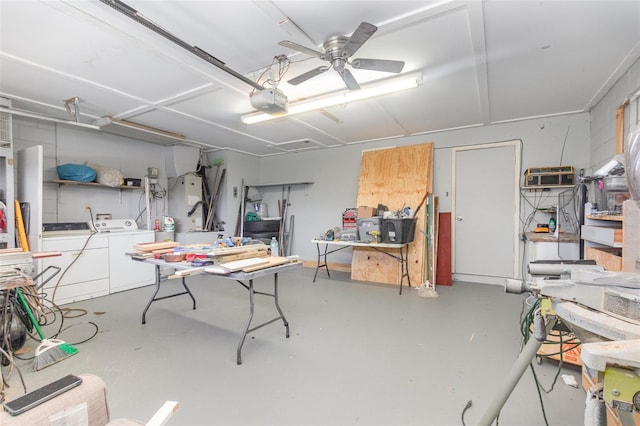 garage with a garage door opener, ceiling fan, and washer and dryer