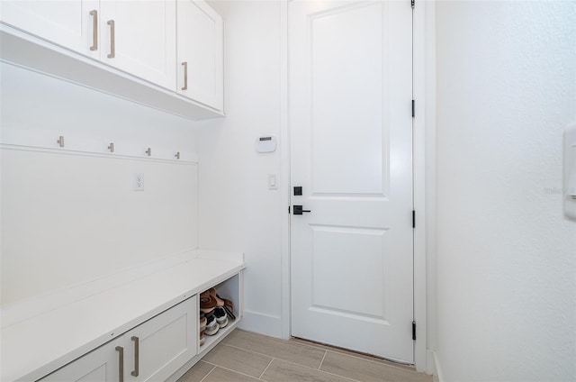 mudroom with light hardwood / wood-style floors