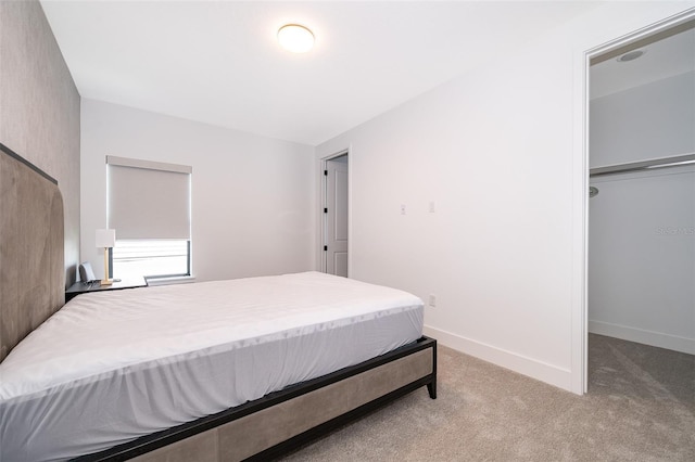 carpeted bedroom featuring a closet