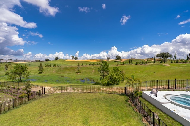 view of yard with a rural view