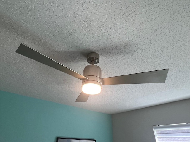 room details featuring a textured ceiling and ceiling fan