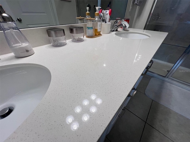 bathroom with vanity and a shower with shower door