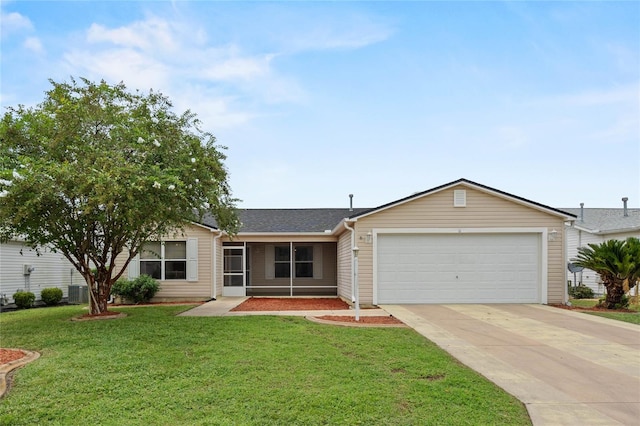 ranch-style home with a garage, central AC unit, and a front yard