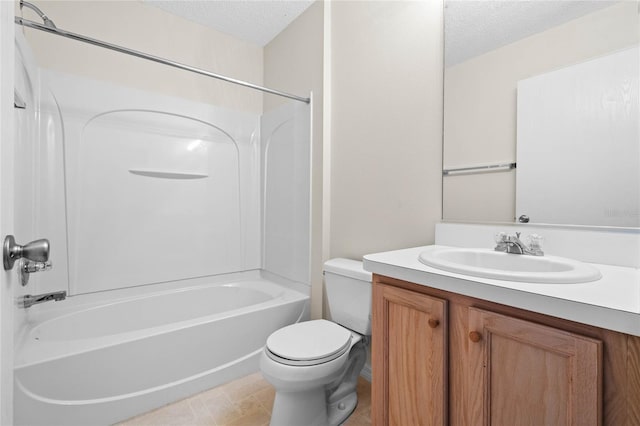 full bathroom featuring washtub / shower combination, toilet, a textured ceiling, and vanity