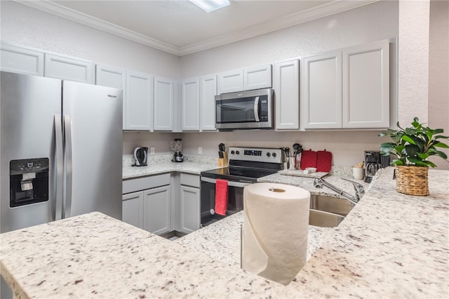 kitchen with ornamental molding, stainless steel appliances, and light stone counters