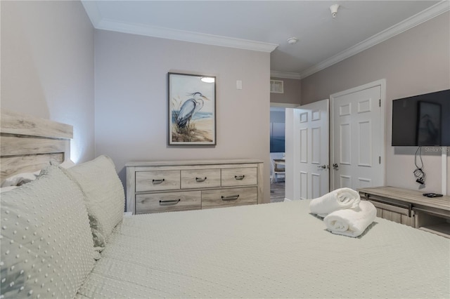 bedroom with crown molding