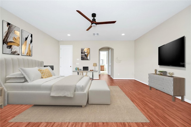 bedroom with hardwood / wood-style flooring and ceiling fan