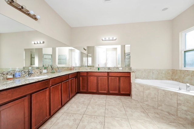 bathroom with tile patterned floors, plus walk in shower, and vanity