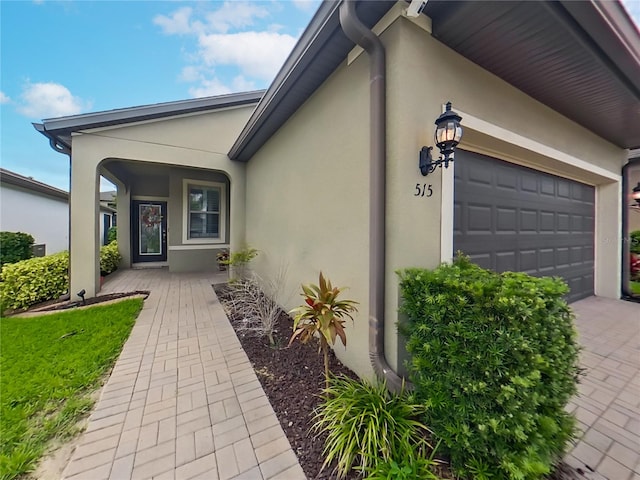 entrance to property featuring a garage