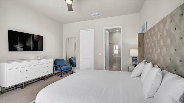 bedroom featuring connected bathroom, carpet flooring, and ceiling fan