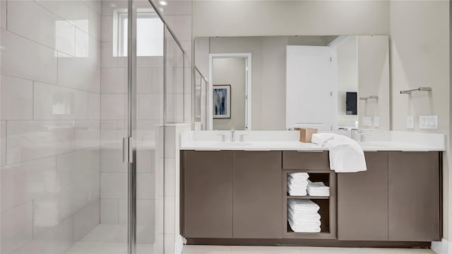 bathroom featuring vanity and a shower with shower door