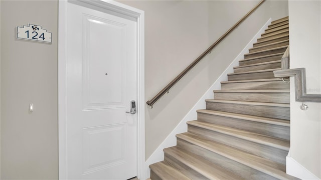 stairway with wood-type flooring