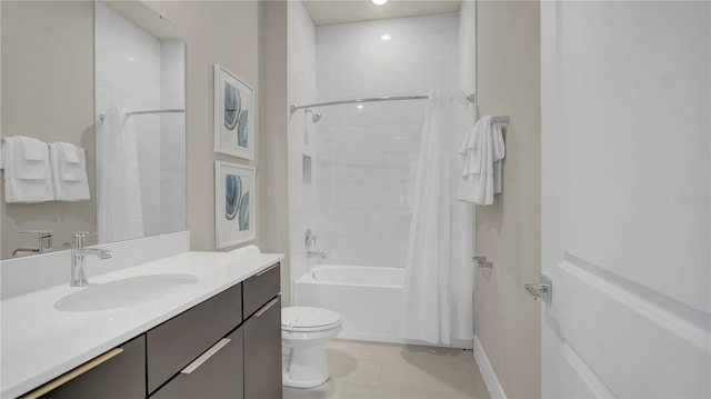 full bathroom featuring tile patterned flooring, vanity, toilet, and shower / bath combo with shower curtain