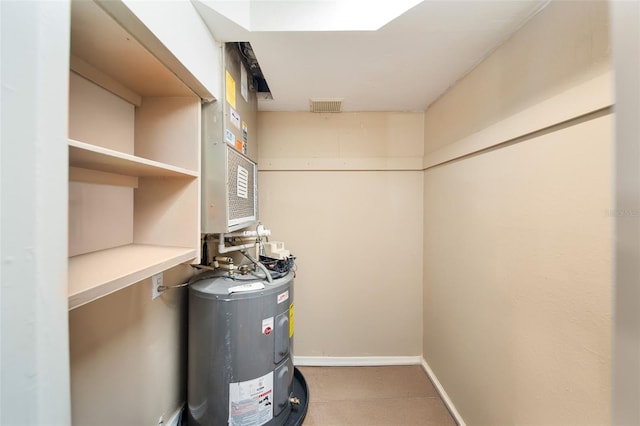 utility room featuring electric water heater