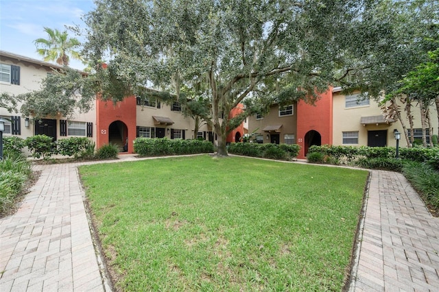 view of property's community with a yard