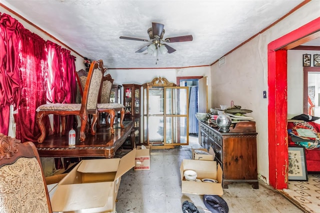 dining room featuring ceiling fan and ornamental molding